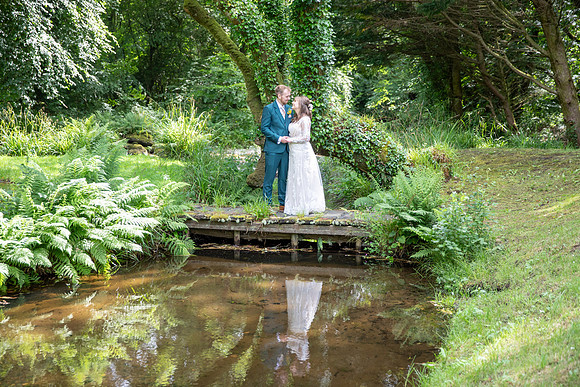 Serene Settings: Wedding Photo by the Water at Talhenbont Hall